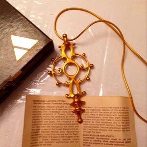 Necklace with fertility symbol.